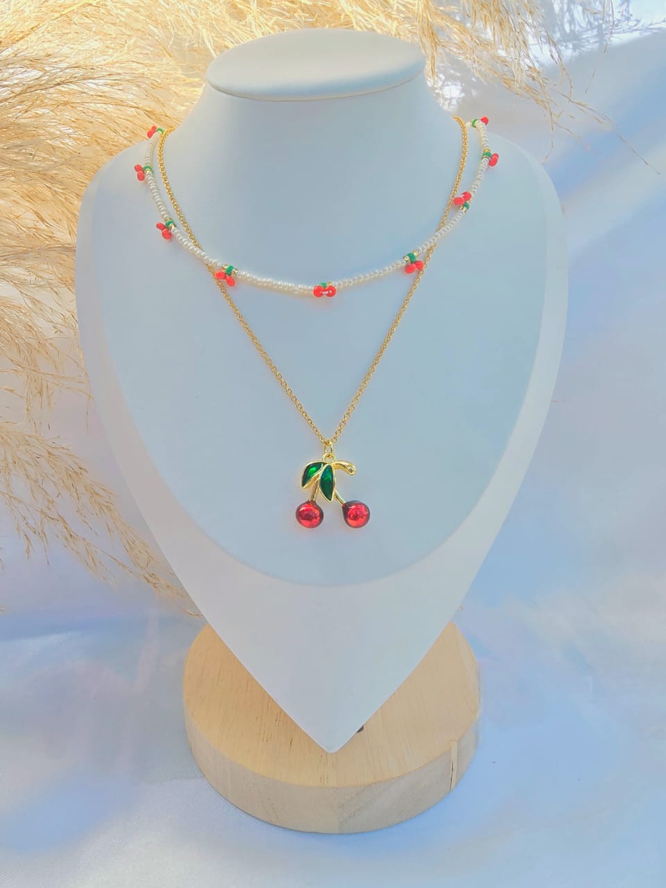 Cadena doble cerezas con dijes