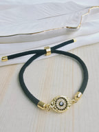 Pulsera cordón con dije en rodio y circones