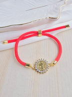 Pulsera cordón con dije en rodio y circones