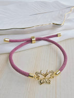 Pulsera cordón con dije en rodio y circones