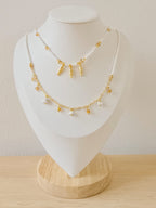 Cadena doble blanco con dijes